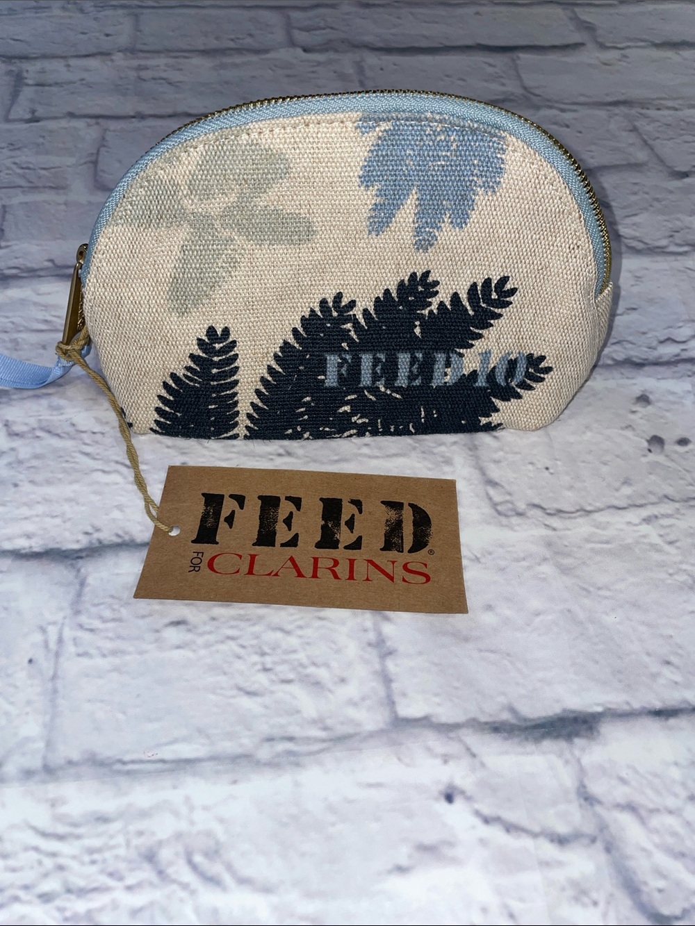 FEED for Clarins Blue and Cream Floral Canvas Cosmetic Pouch